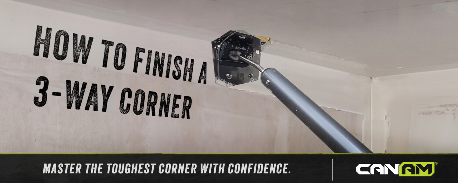 A 3-way drywall corner being finished with a corner finisher run down each of the three angles, then cleaned at the point by hand
